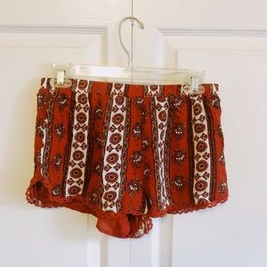 orange patterned shorts